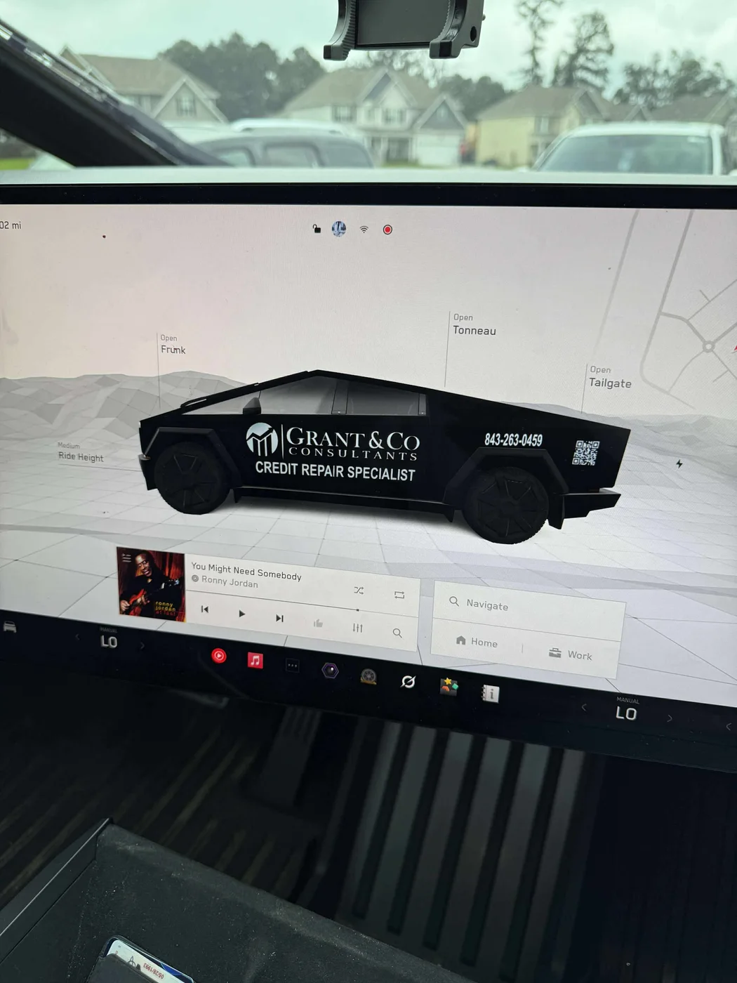 Grant and Company Cybertruck digital wrap shown on the Tesla center display